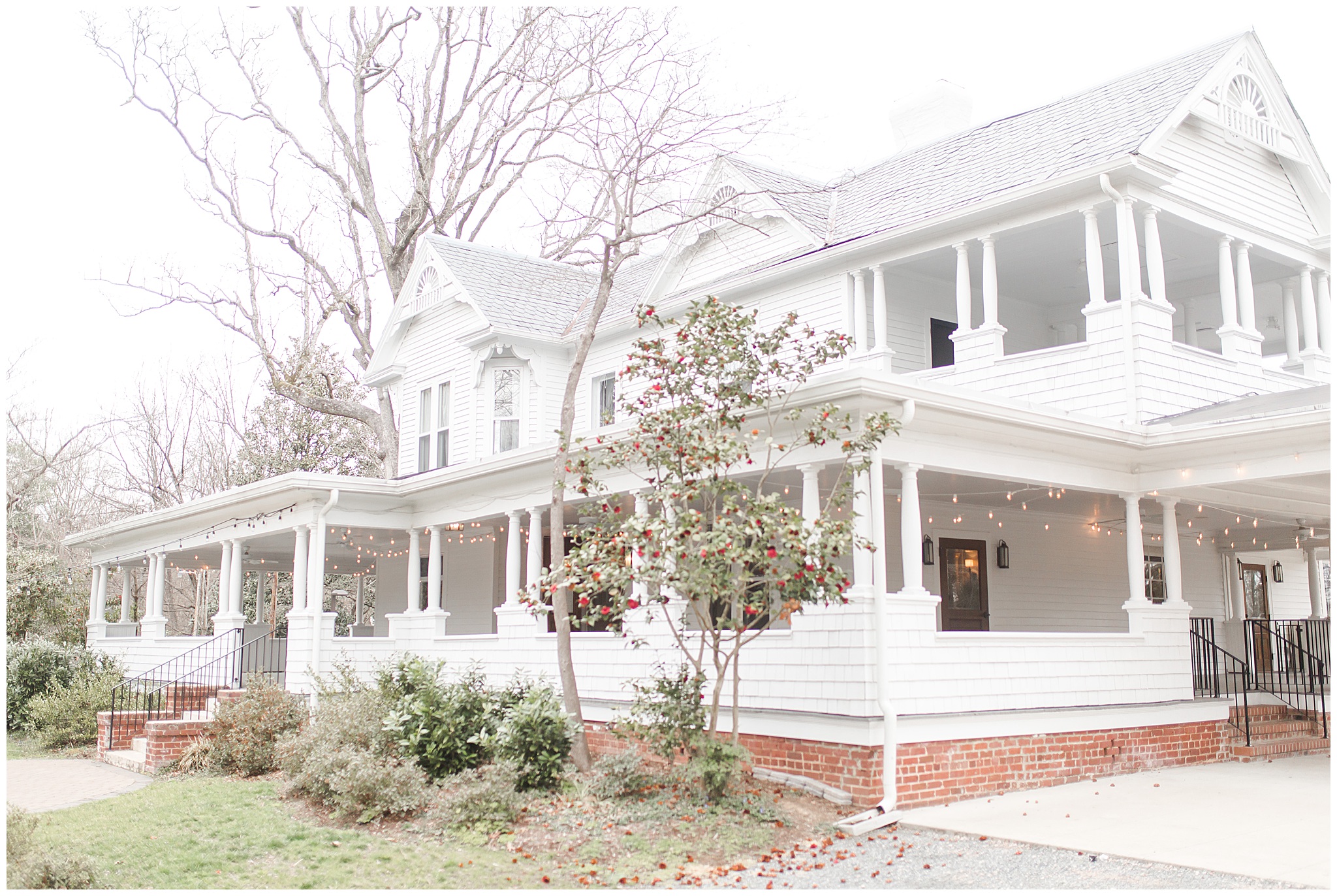 on ritchie hill wedding venue, white farmhouse with huge wrap around porch